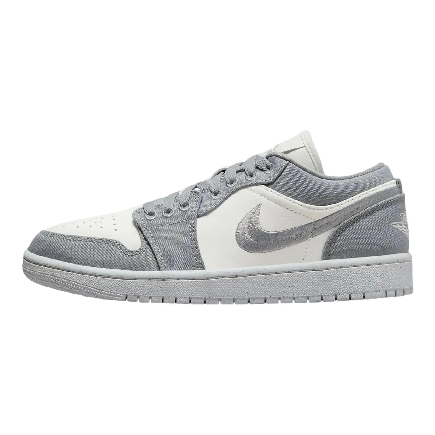 Gray and white Nike Air Jordan 1 low-top sneaker with iconic swoosh, perfect for women's fashion