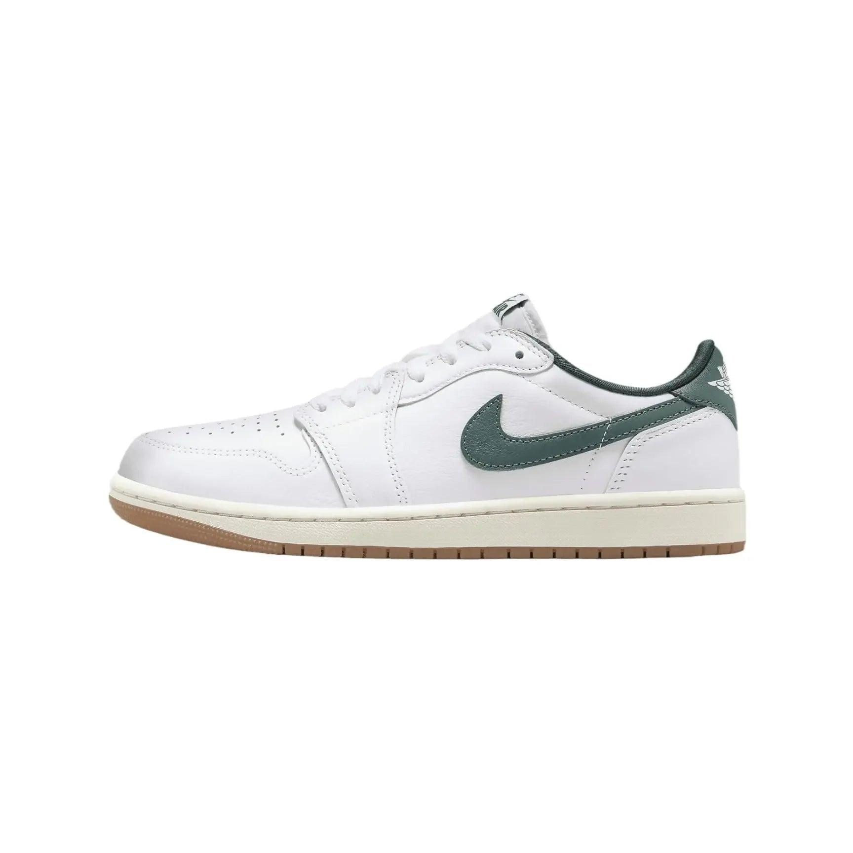 White low-top sneaker with green swoosh and gum sole, stylish women's fashion footwear