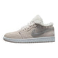 Beige suede women's sneaker with white shearling collar and Nike swoosh, fashion footwear