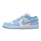 Light blue and white low-top sneaker with Nike swoosh, perfect for women's fashion and casual wear