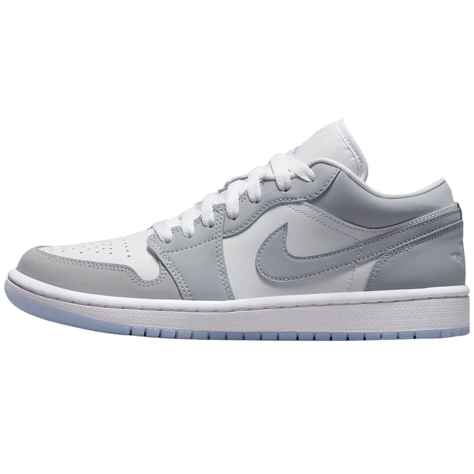 Light gray women's low-top sneaker with white laces and Nike swoosh, stylish casual footwear