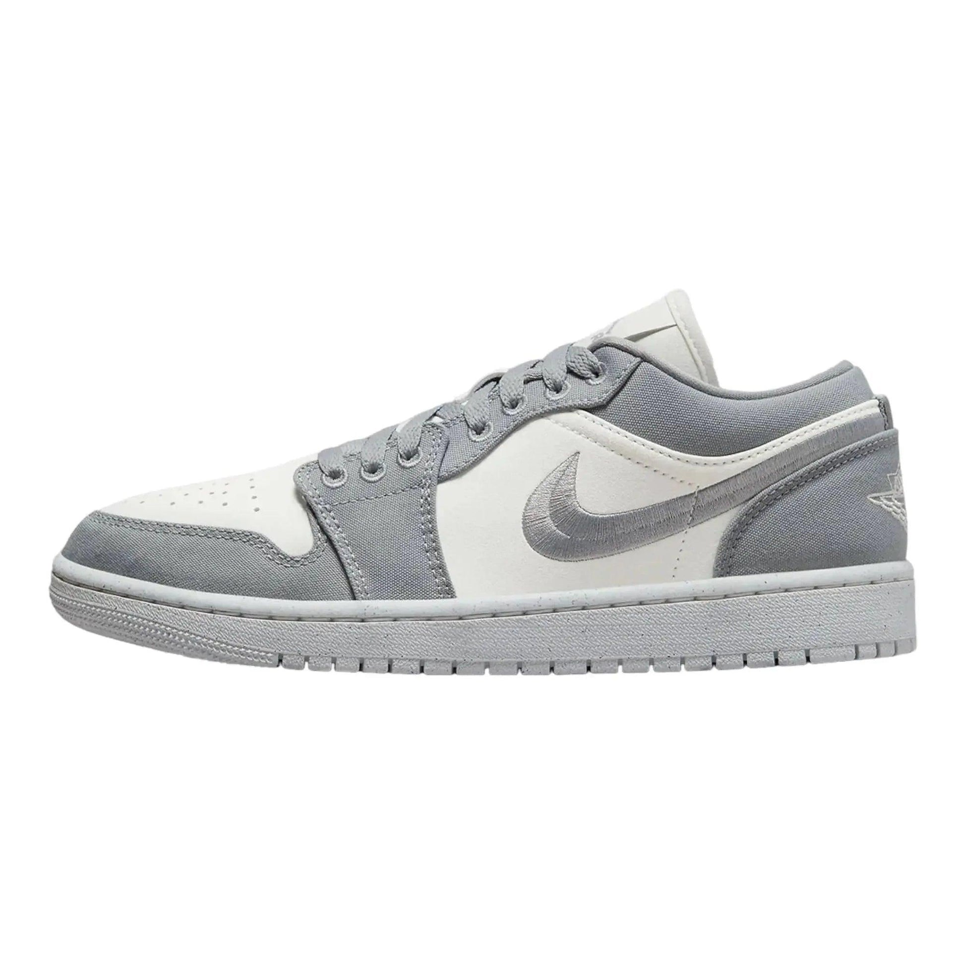 Gray and white low-top sneaker with Nike swoosh, ideal for women's fashion and casual wear