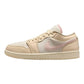 Beige and pink women's low-top sneaker with Nike swoosh, ideal for casual fashion and everyday wear