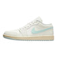 White low-top sneaker with mint green swoosh, perfect for women's fashion and casual style