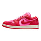 Vibrant pink and red women's fashion sneaker with bold Nike swoosh, perfect for stylish streetwear looks.