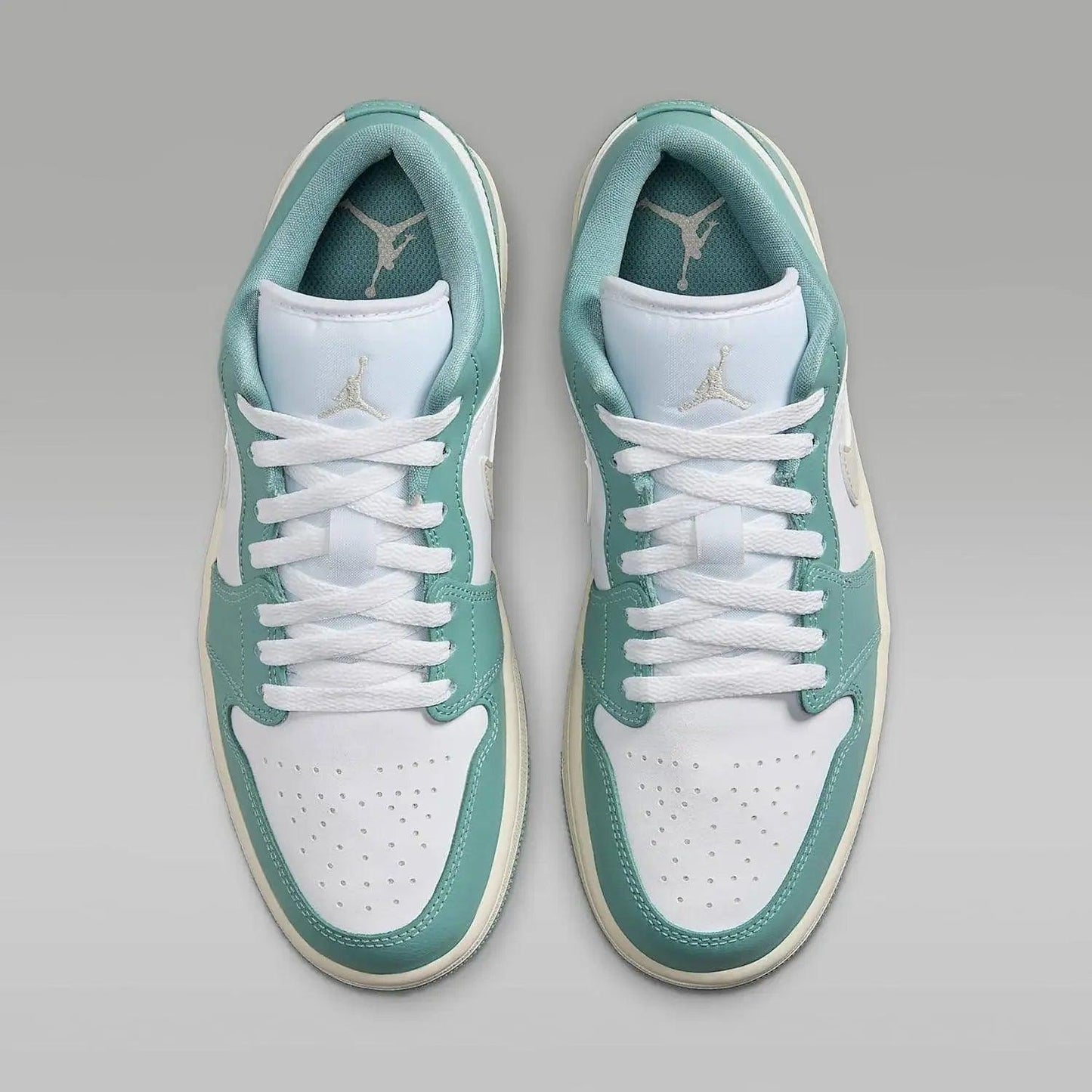 Mint green and white low-top sneakers with Jumpman logo, ideal for women's fashion and casual wear