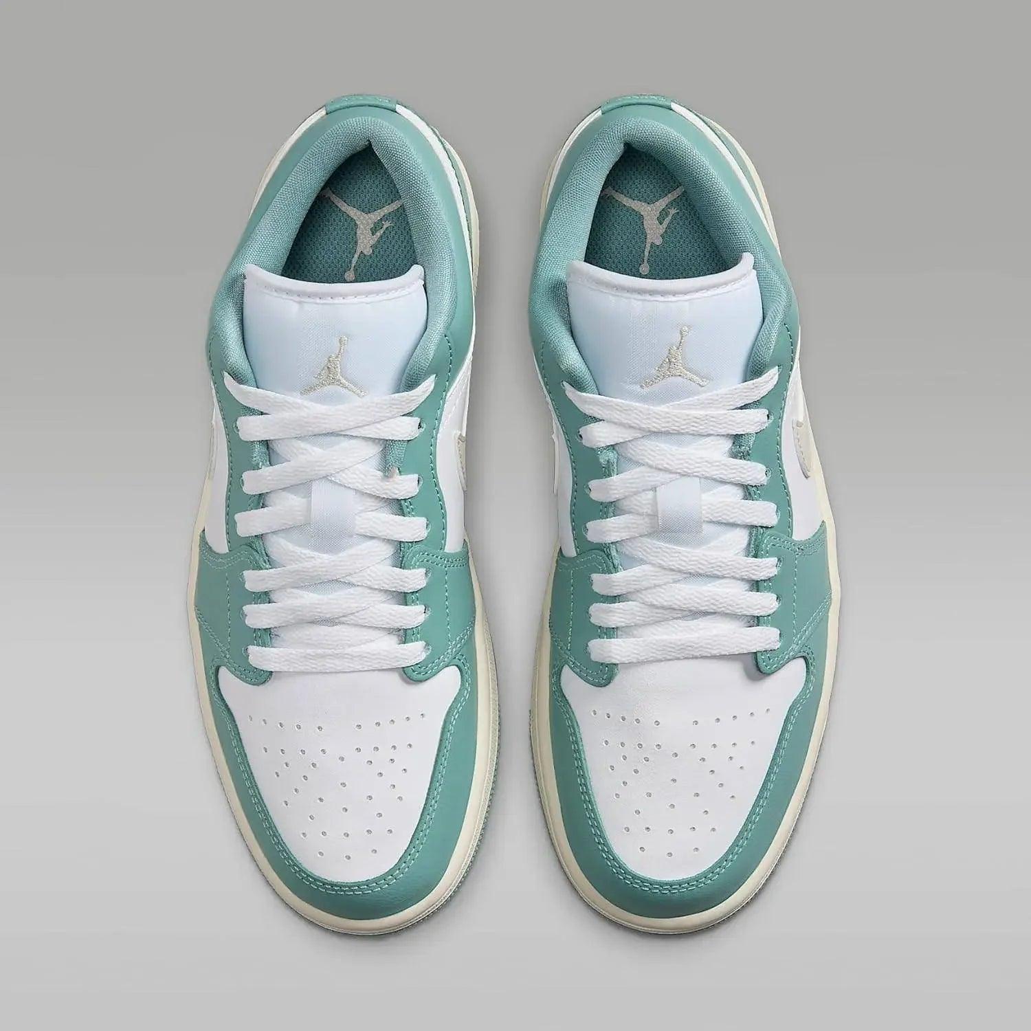 Mint green and white low-top sneakers with Jumpman logo, ideal for women's fashion and casual wear