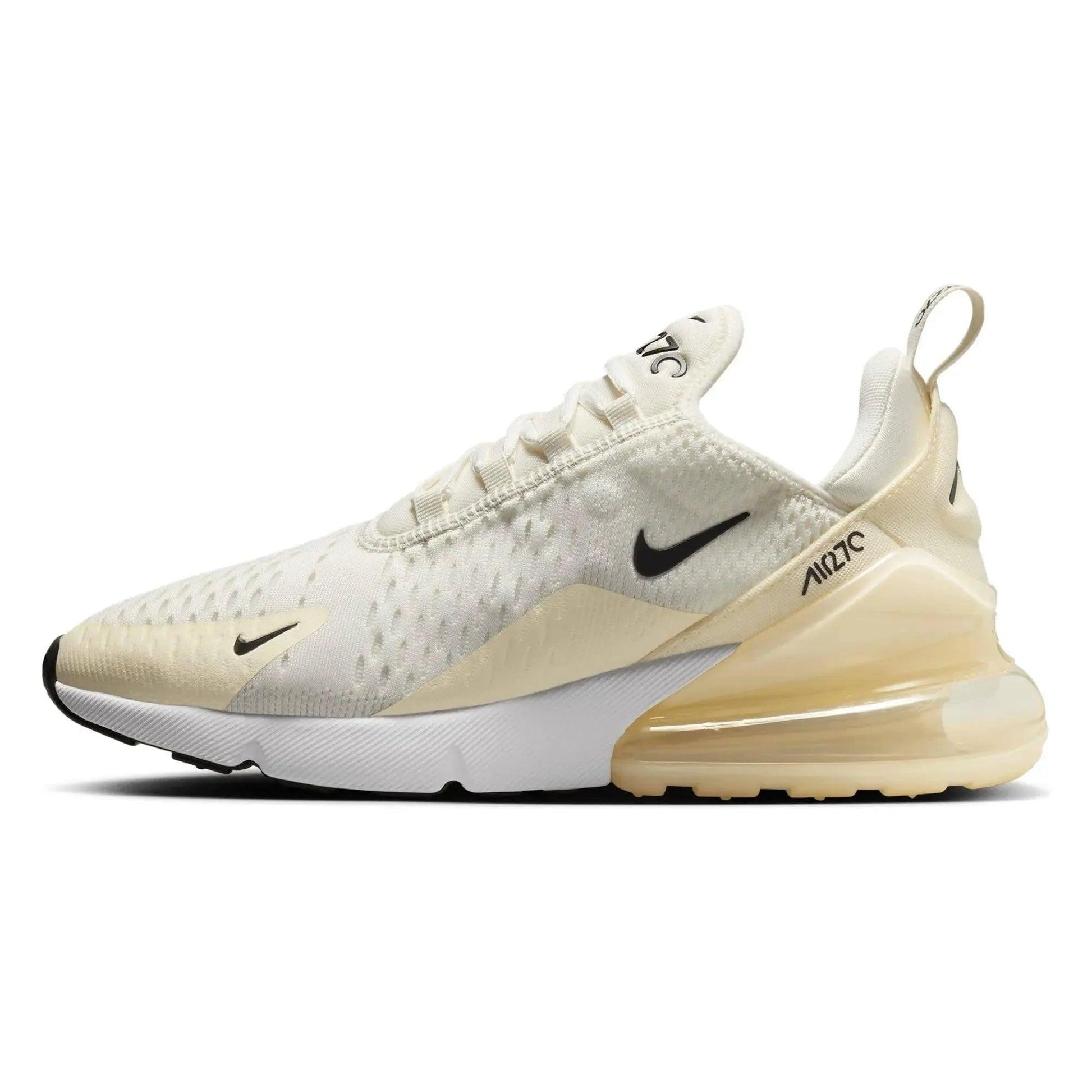 Cream Nike Air Max 270 sneaker with black swoosh, breathable mesh upper, and visible air cushion sole for women's fashion