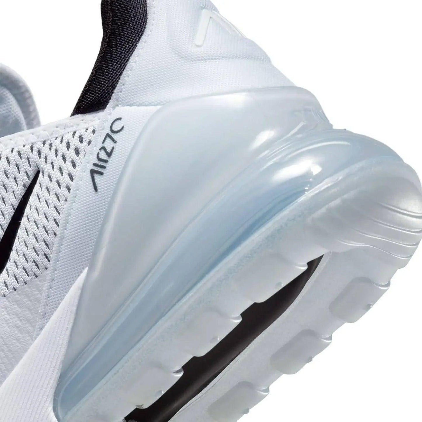 White Nike Air 270 women's sneaker with visible air cushion sole and mesh upper