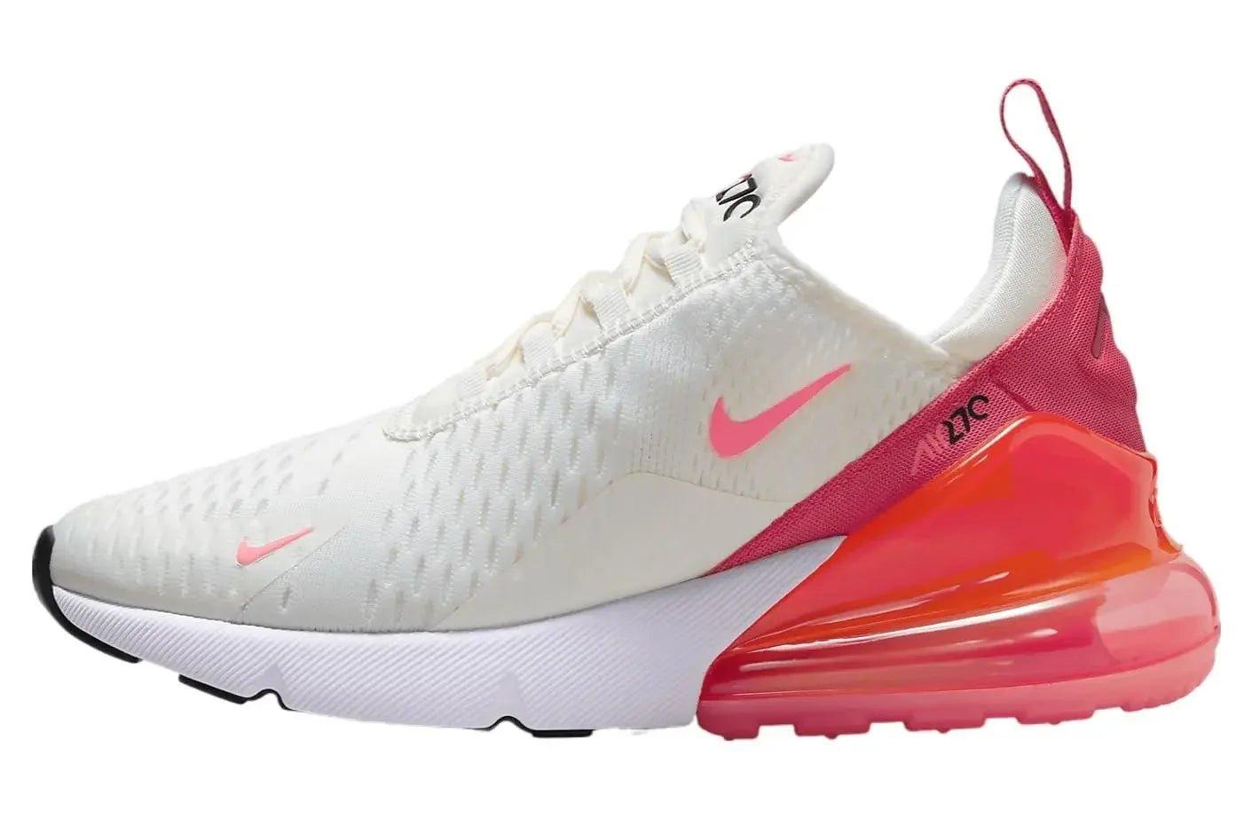 White Nike Air Max 270 women's sneaker with pink swoosh and gradient red-orange sole