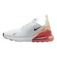 White Nike Air Max 270 sneaker with coral air unit, mesh upper, and black swoosh for women's fashion