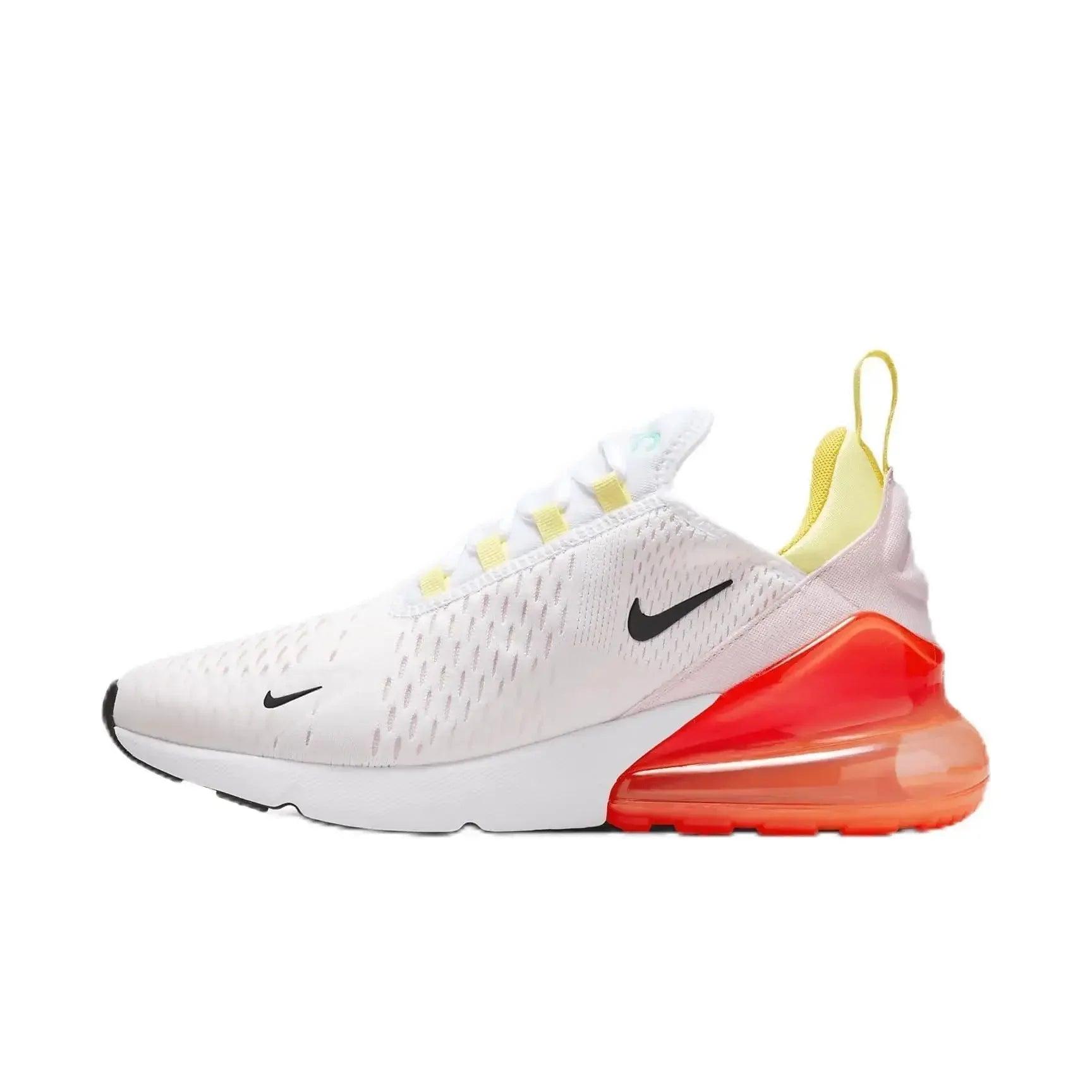 White Nike Air Max 270 sneaker with vibrant orange sole and yellow accents, stylish women's fashion footwear