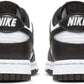 Black and white Nike sneakers with bold logo, stylish women's fashion footwear
