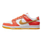 Orange and gold Nike Dunk Low sneaker with white accents, stylish women's fashion footwear