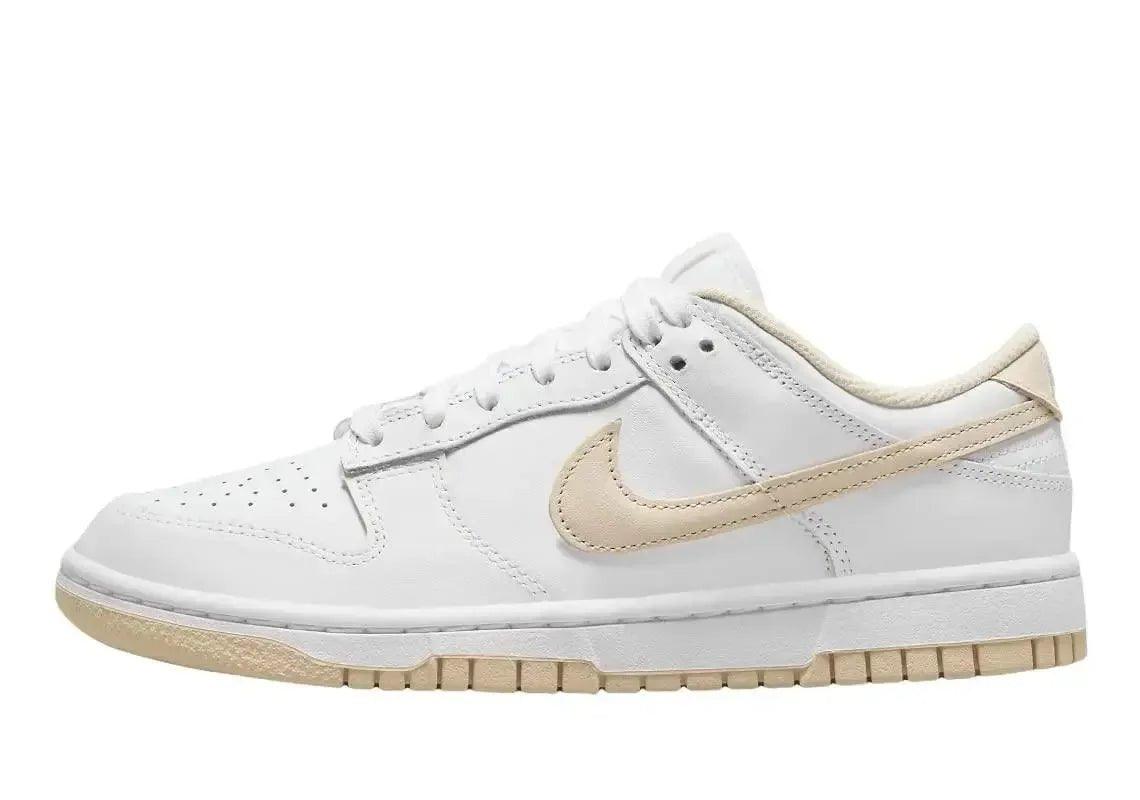 White Nike Dunk Low sneaker with beige Swoosh and gum sole, women's fashion footwear