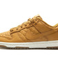 Tan quilted Nike Dunk Low sneaker with white sole, women's fashion footwear