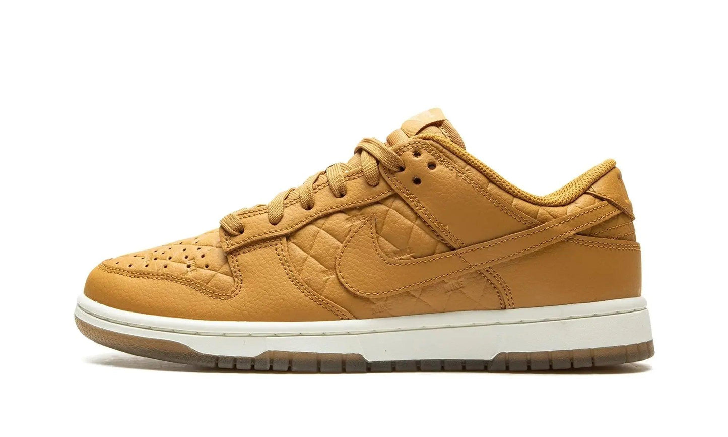Tan quilted Nike Dunk Low sneaker with white sole, women's fashion footwear