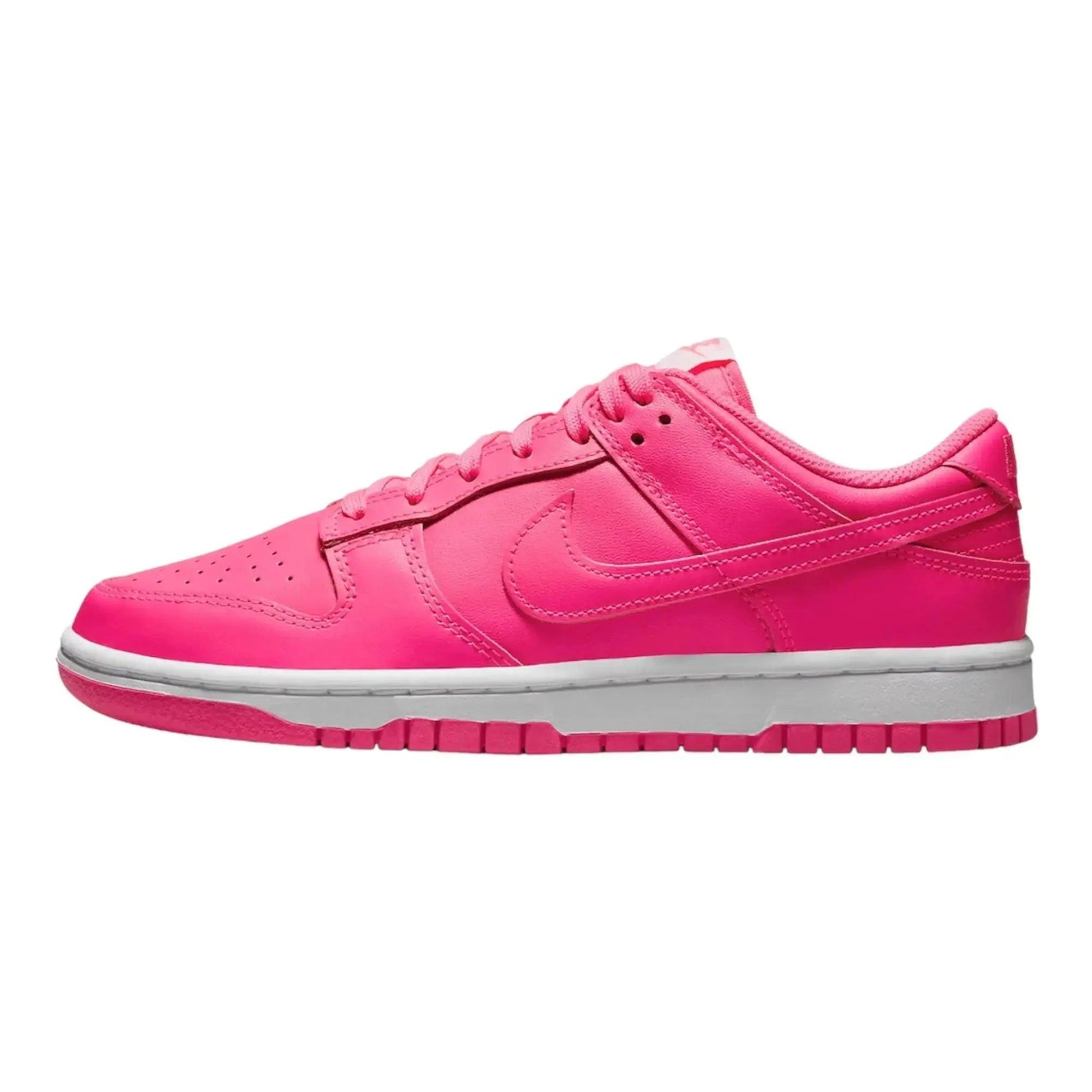 Vibrant pink women's Nike Dunk Low sneaker with white sole, perfect for fashion and casual wear.