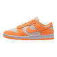 Vibrant orange and white Nike Dunk Low sneaker, stylish women's fashion footwear
