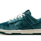 Teal velvet Nike Dunk Low sneaker with white laces and cream sole, stylish women's fashion footwear
