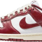 Red and white Nike Dunk Low sneaker with classic leather design and iconic swoosh logo