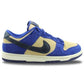 Blue and beige Nike Dunk Low sneaker with black swoosh, stylish women's fashion footwear