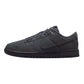 All black Nike Dunk Low sneaker with classic design and perforated toe box