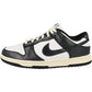 Black and white Nike Dunk Low sneaker with cream sole, classic low-top design for women's fashion
