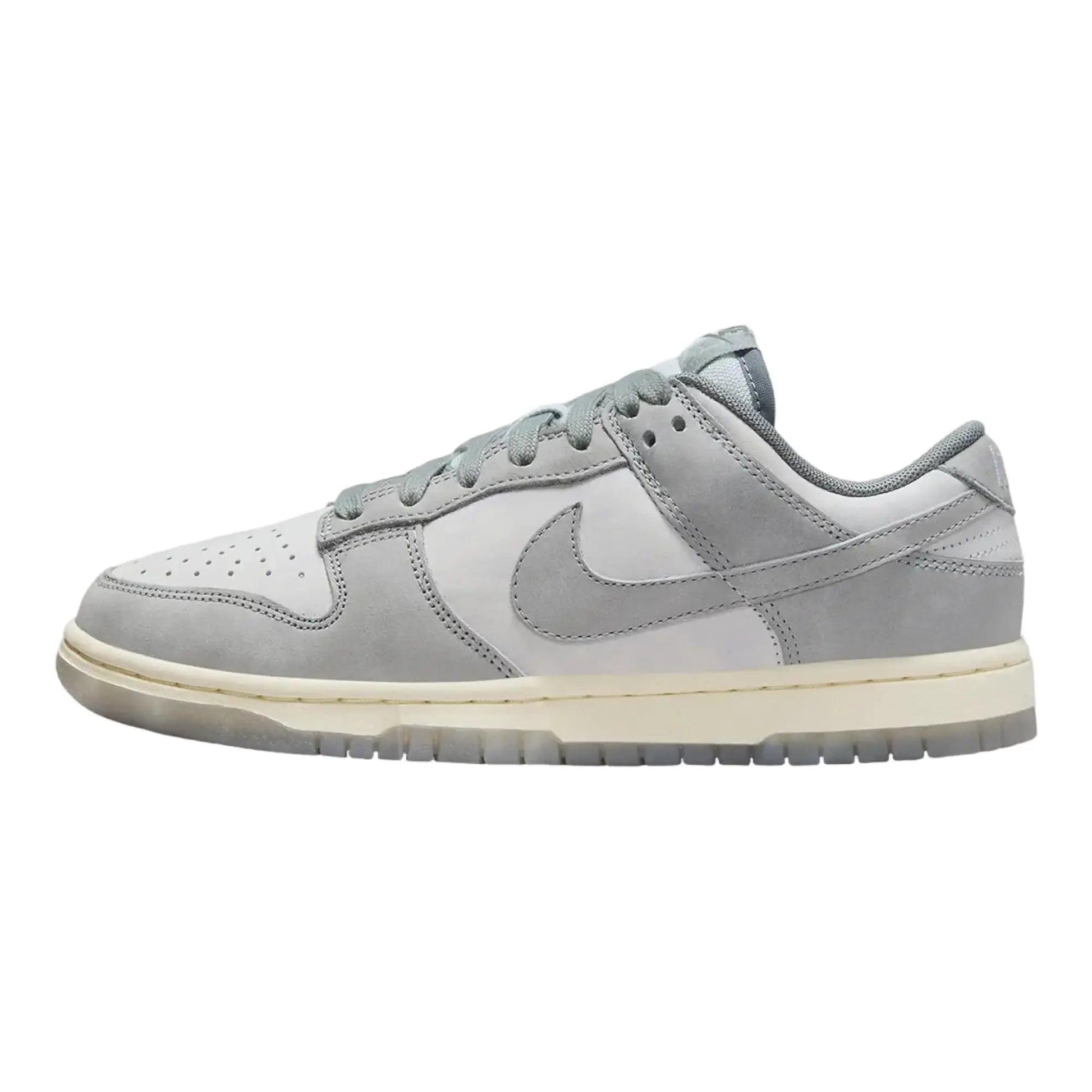 Gray Nike Dunk Low sneaker with white sole, perfect for women's fashion and casual wear