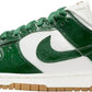 Green and white Nike Dunk Low sneaker with textured leather and gum sole, women's fashion footwear