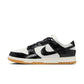 Black and white women's fashion sneaker with croc-textured leather and gum sole