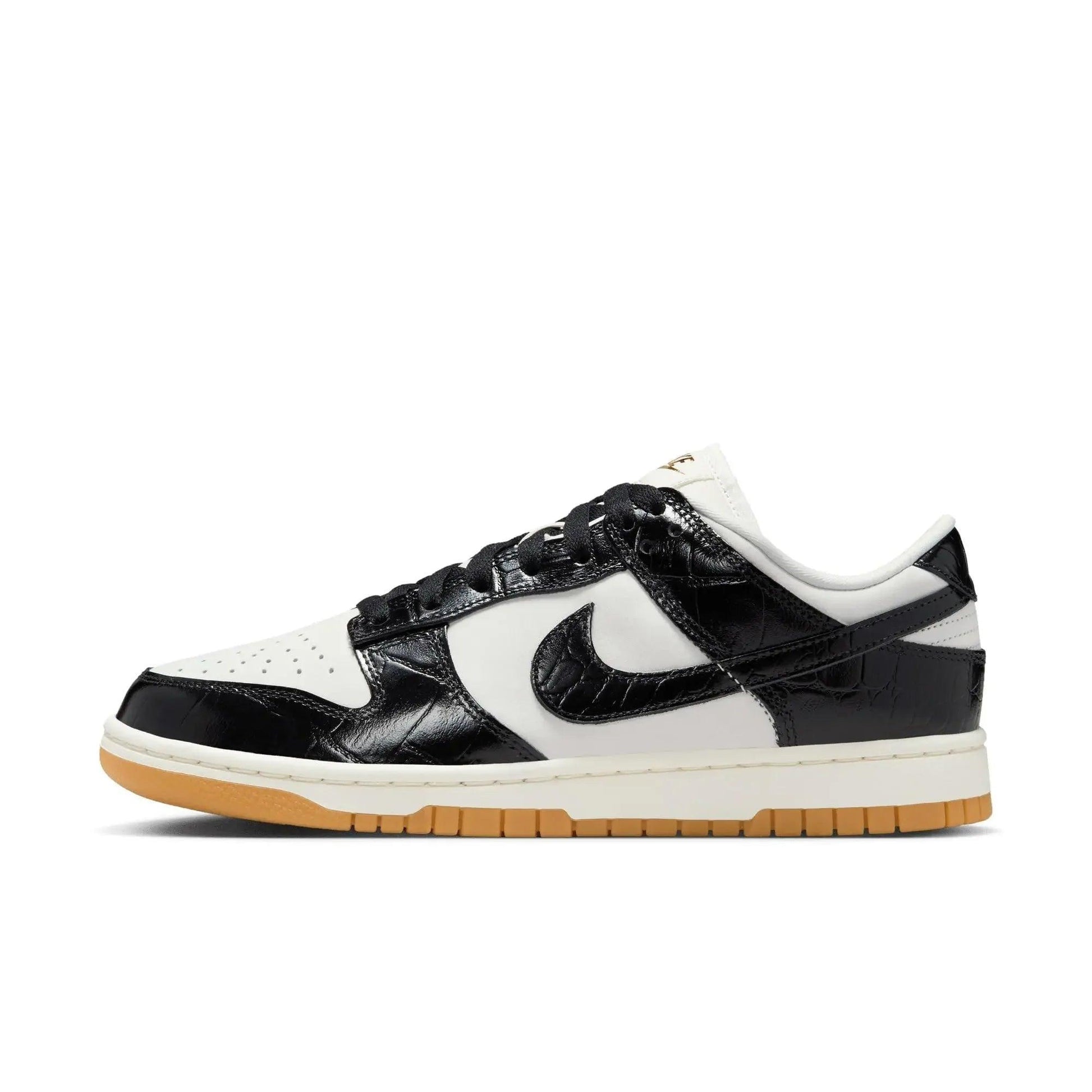 Black and white women's fashion sneaker with croc-textured leather and gum sole