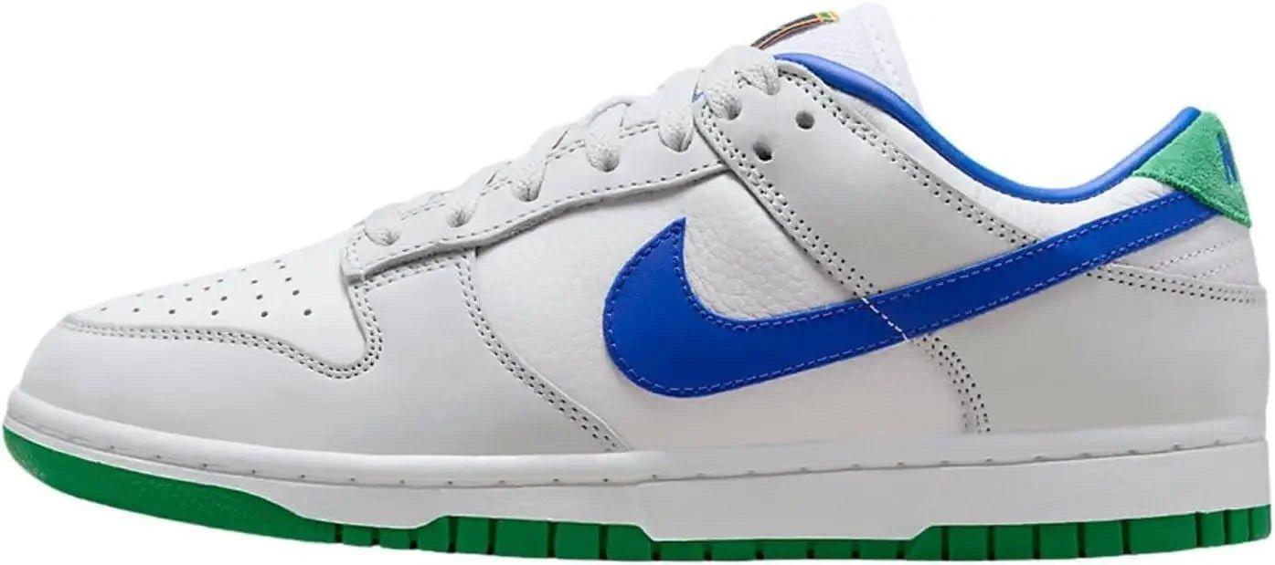 White Nike Dunk Low sneaker with royal blue swoosh and green sole, women's fashion footwear