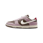 Purple and brown Nike Dunk Low sneaker with white swoosh and red heel tab, women's fashion footwear