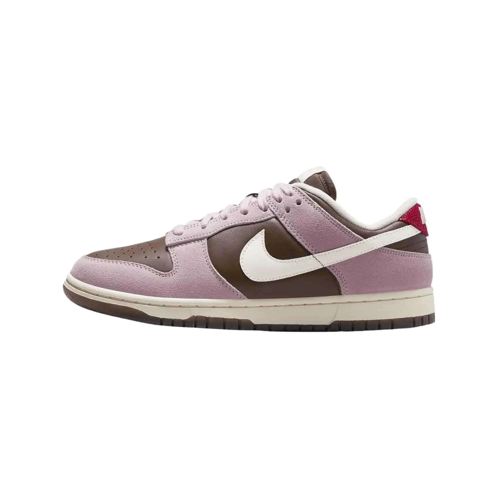 Purple and brown Nike Dunk Low sneaker with white swoosh and red heel tab, women's fashion footwear