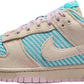 Pastel pink and teal Nike Dunk sneaker with striped canvas upper, ideal for women's fashion and casual wear