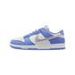 Light blue and white Nike Dunk Low sneaker with silver swoosh, women's fashion footwear