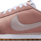 Pink Nike Cortez women's fashion sneaker with white laces and gum sole