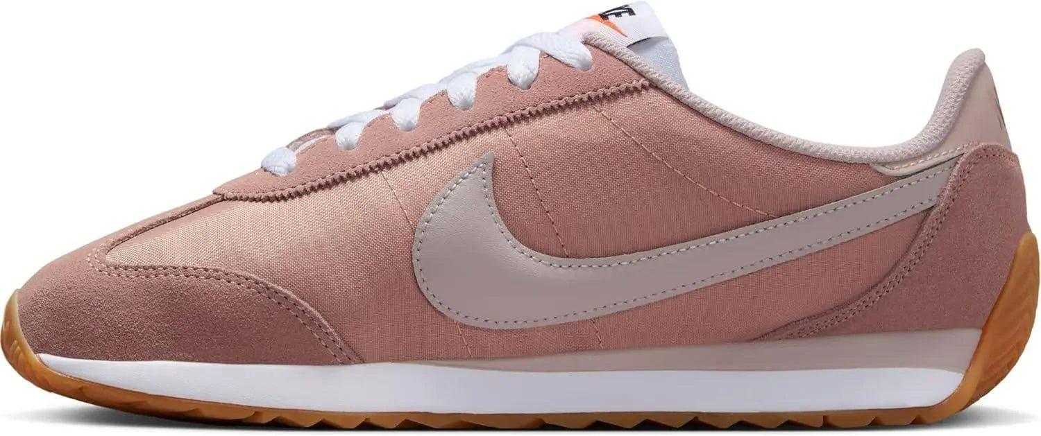 Pink Nike Cortez women's fashion sneaker with white laces and gum sole