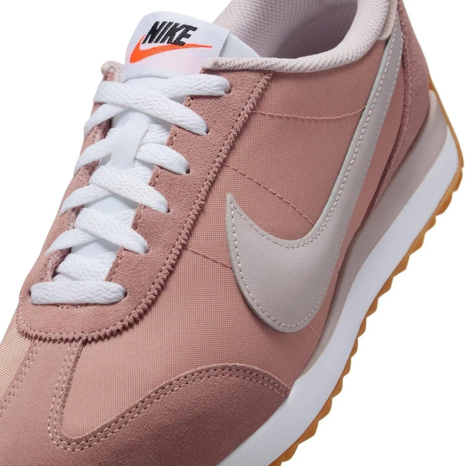 Pink Nike Cortez sneaker with white laces and gum sole, women's fashion footwear