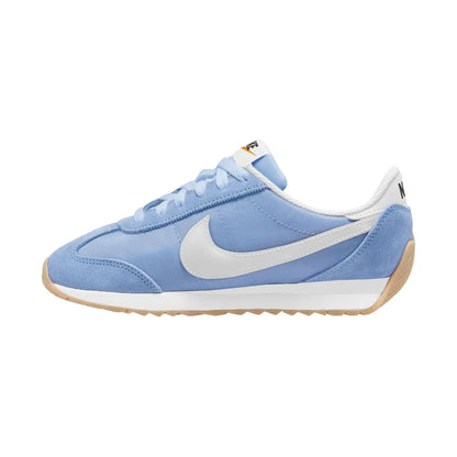 Light blue Nike Cortez sneaker with white swoosh and gum sole, women's fashion footwear