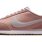 Pink Nike Cortez sneaker with white swoosh and gum sole, women's fashion footwear