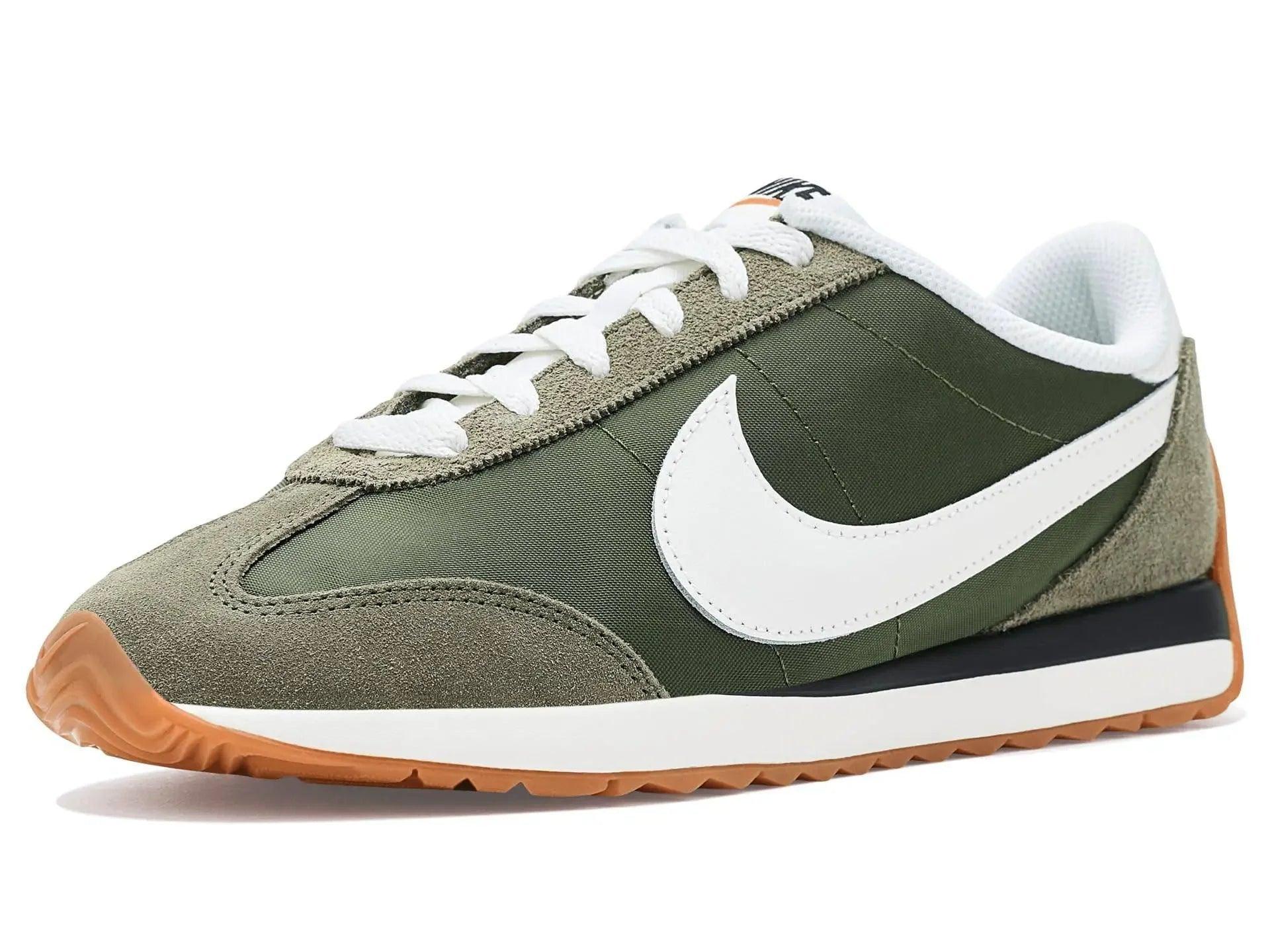 Olive green Nike sneaker with white swoosh, white laces, and gum sole for women's fashion