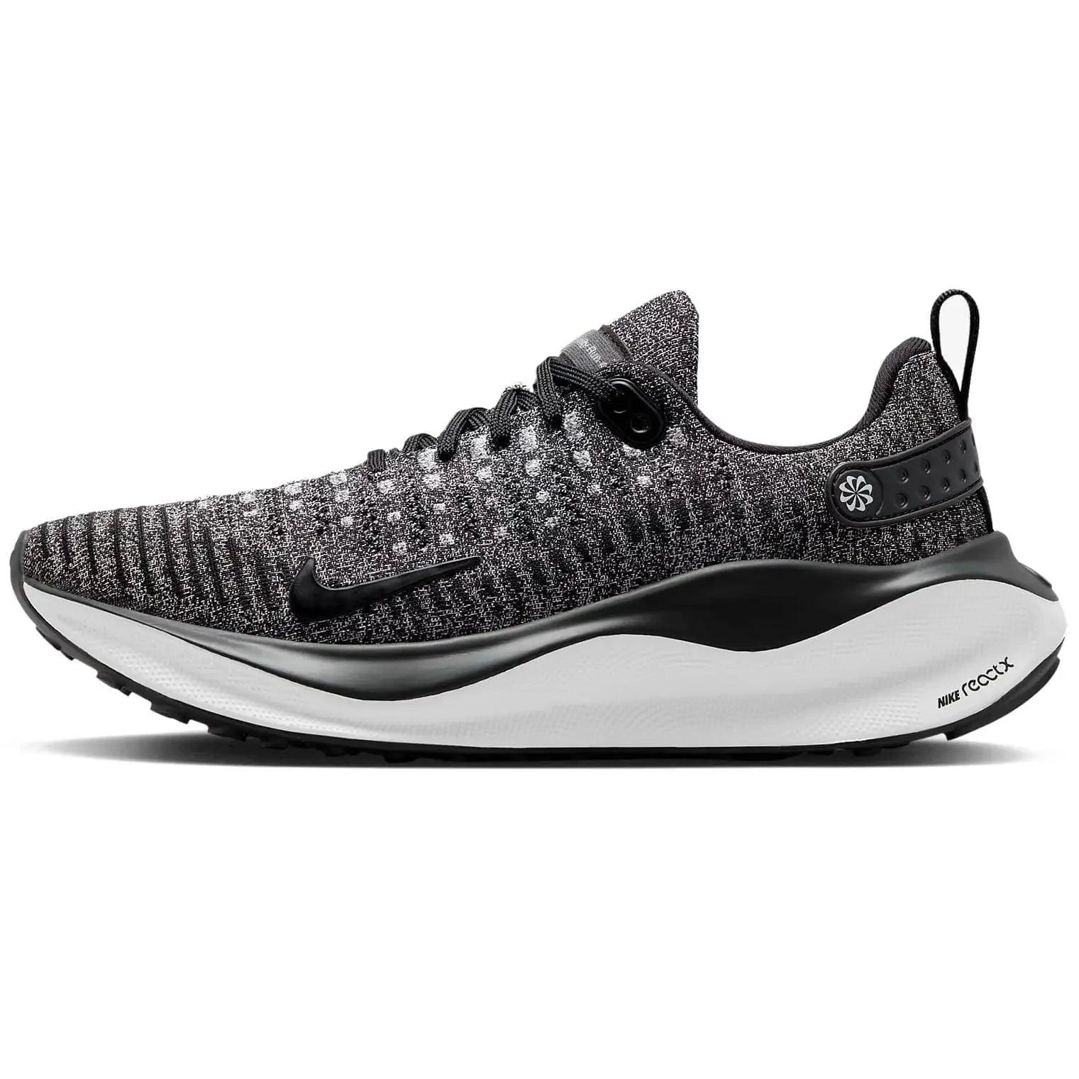 Nike React X running shoe with black and white knit upper, cushioned sole, and swoosh logo