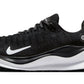 Black Nike React X running shoe with white swoosh and cushioned sole for women's fashion and fitness