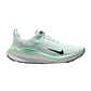 Mint green women's running shoe with black swoosh and pink accents, lightweight athletic sneaker