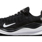 Black Nike React X running shoe with white swoosh and cushioned sole for women's fashion and athletic wear