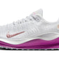 White Nike running shoe with pink swoosh and purple sole, women's athletic footwear