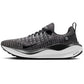 Nike React X running shoe with black and white knit upper, cushioned sole, and swoosh logo