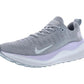 Gray Nike running shoe with lavender sole, breathable knit upper, and white swoosh logo for women's fitness